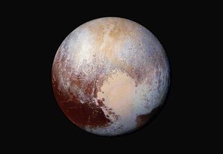 Pluto, as seen by NASA&rsquo;s New Horizons spacecraft during its flyby of the dwarf planet in July 2015.