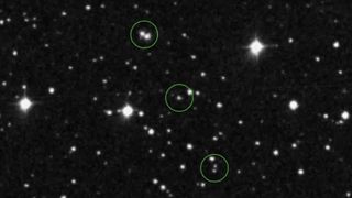 images of stars on a black background, with what appear to be other stars among them circled by dotted lines